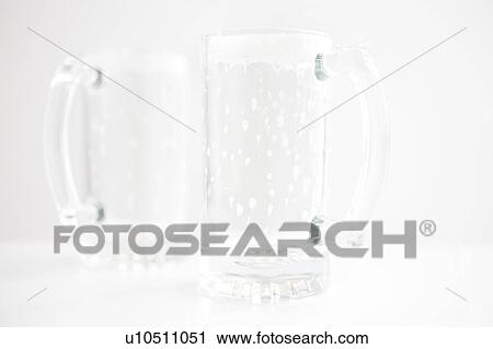 Stock Image - Empty beer glasses. Fotosearch