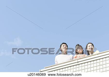 Family at balcony, Hyogo Prefecture, Honshu, Japan View Large Photo Image Stock Photo - Family at balcony, Hyogo Prefecture, Honshu, Japan. Fotosearch