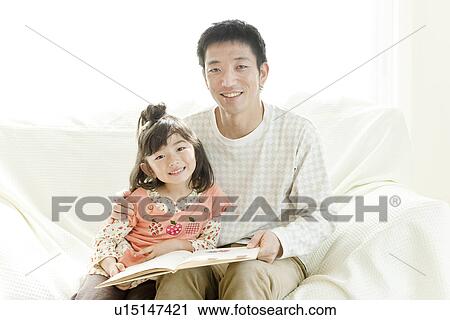 Father reading book to daughter View Large Photo Image Stock Image - Father reading book to daughter. Fotosearch