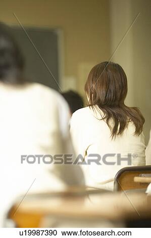 Stock Image - High school girl in classroom, Japan. Fotosearch