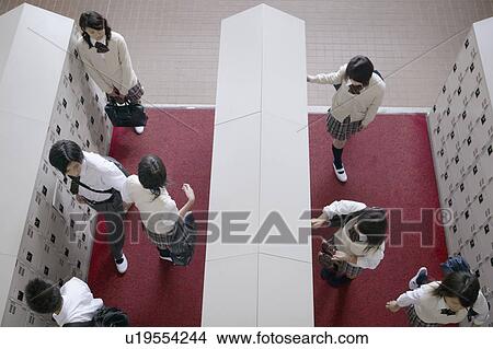 High school student at locker changing shoes, Japan View Large Photo Image Picture - High school student at locker changing shoes, Japan. Fotosearch