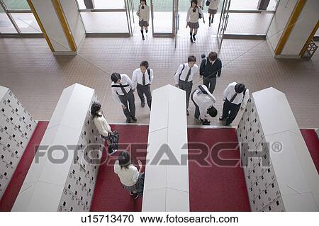 Stock Image - High school students entering school, Japan. Fotosearch