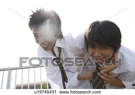 Stock Image - High school students on rooftop, Japan. Fotosearch