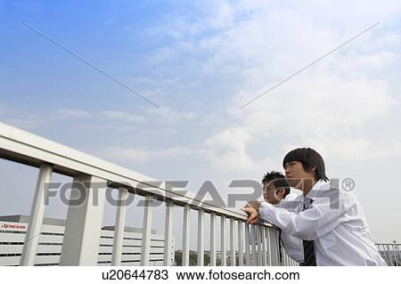 Stock Image - High school students on rooftop, Japan. Fotosearch