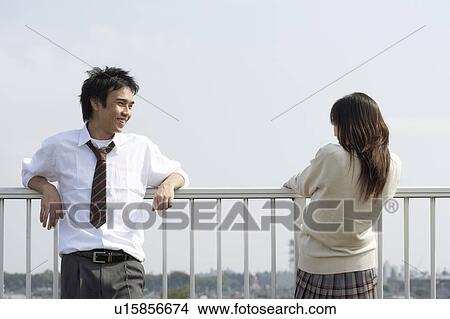 Picture - High school students talking on rooftop, Japan. Fotosearch