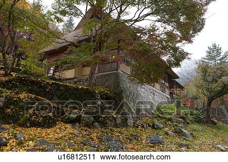 Stock Image - House in Korankei Valley in Autumn. Fotosearch
