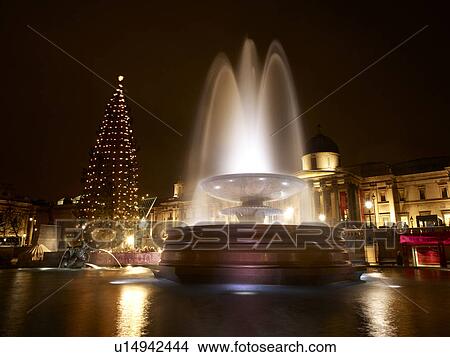Picture - Illuminated Water Fountain Trafalgar Square. Fotosearch