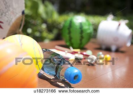 Stock Photograph - Japanese toys and bottle of soda. Fotosearch