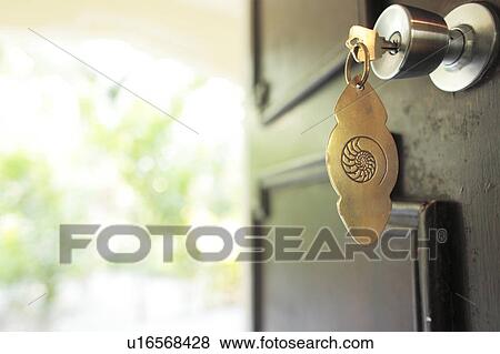 Stock Photo - Key in Front Door. Fotosearch
