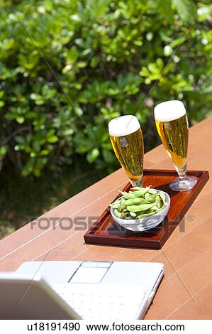 Laptop, beer and edamame View Large Photo Image Stock Image - Laptop, beer and edamame. Fotosearch