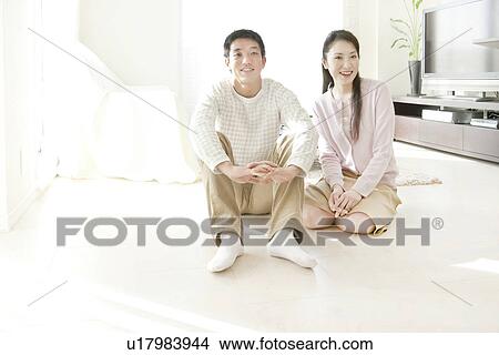 Mid Adult Couple Sitting on Floor View Large Photo Image Picture - Mid Adult Couple Sitting on Floor. Fotosearch