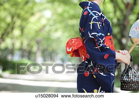 Midsection of young woman wearing Yukata View Large Photo Image Picture - Midsection of young woman wearing Yukata. Fotosearch