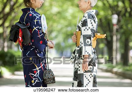 Mother and daughter wearing Yukata and talking View Large Photo Image Stock Photo - Mother and daughter wearing Yukata and talking. Fotosearch