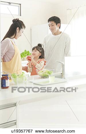 Mother and Father Cooking with Daughter View Large Photo Image Stock Photo - Mother and Father Cooking with Daughter. Fotosearch