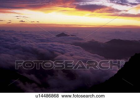 Stock Photo - Mount Okuhotaka in Clouds. Fotosearch