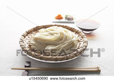 Stock Image - Noodles and soup in glass bowl. Fotosearch
