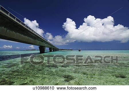 Stock Image - Ohashi between ponds, and cumulonimbus. Fotosearch