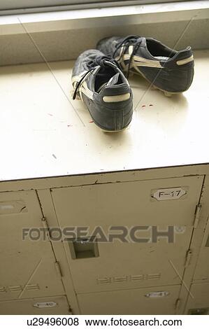 Stock Photo - Pair of soccer shoes on the locker. Fotosearch