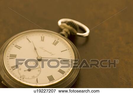 Stock Photo - Pocket watch on books. Fotosearch