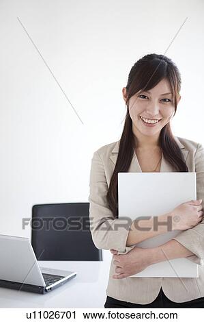 Stock Image - Portrait of businesswoman. Fotosearch