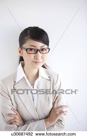 Portrait of businesswoman wearing glasses View Large Photo Image Stock Image - Portrait of businesswoman wearing glasses. Fotosearch