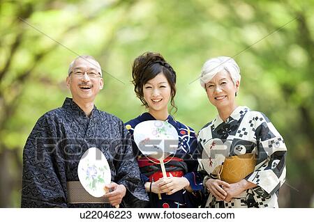 Stock Image - Portrait of family wearing Yukata. Fotosearch