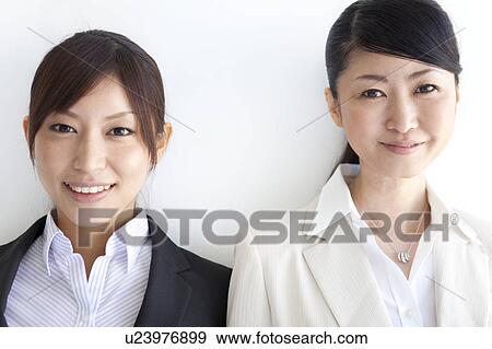 Stock Photo - Portrait of two businesswomen. Fotosearch