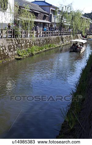 Stock Image - Recreational Boat in Ona River in Katori District. Fotosearch