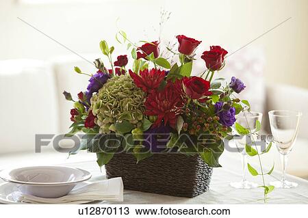 Stock Image - Red Bouquet on Dining Table. Fotosearch