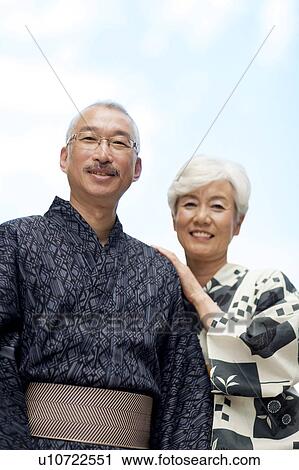 Stock Image - Senior couple wearing Yukata smiling. Fotosearch