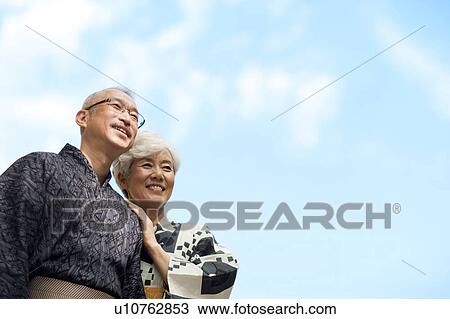 Stock Image - Senior couple wearing Yukata smiling. Fotosearch
