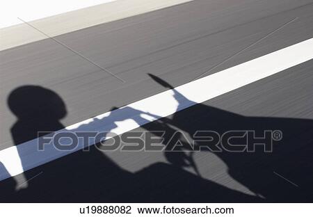 Shadow of adult driving a moped View Large Photo Image Stock Image - Shadow of adult driving a moped. Fotosearch