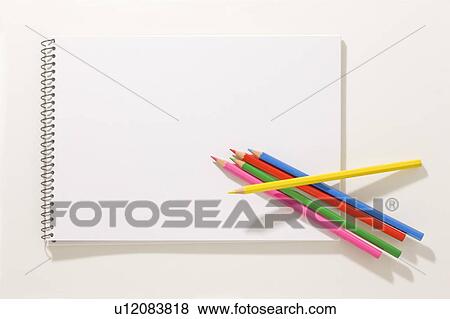 Stock Photo - Sketch book and colored pencils. Fotosearch