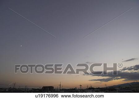Stock Photograph - Sky at dusk, low angle view, Osaka Prefecture, Honshu, Japan. Fotosearch