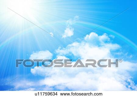 Picture - Sky, rainbow and sunbeam, digital composite. Fotosearch