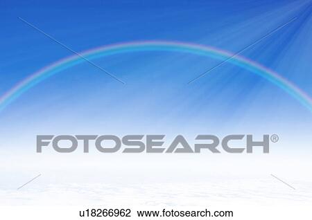 Stock Image - Sky, rainbow and sunbeam. Fotosearch