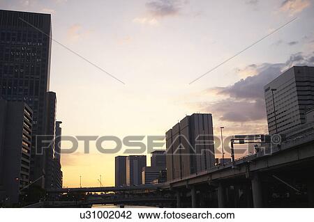 Stock Image - Skyline of Osaka at dusk, Japan. Fotosearch