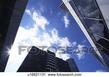 Stock Image - Skyscrapers, low angle view, Osaka Prefecture, Honshu, Japan. Fotosearch