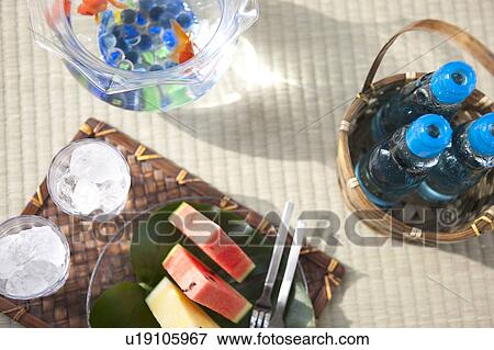 Slices of watermelons and glasses with ice cubes inside View Large Photo Image Stock Photo - Slices of watermelons and glasses with ice cubes inside. Fotosearch