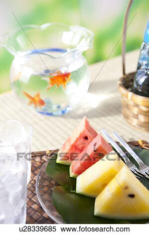 Slices of watermelons and glasses with ice cubes inside View Large Photo Image Stock Photography - Slices of watermelons and glasses with ice cubes inside. Fotosearch