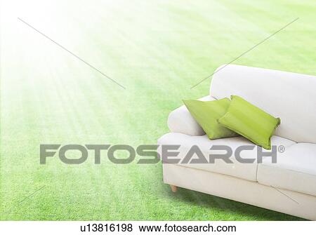 Stock Photo - Sofa on a lawn, digital composite. Fotosearch
