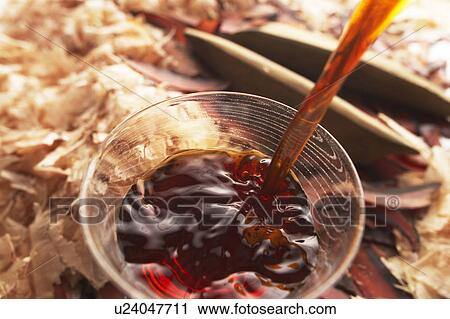 Soup being poured into a glass bowl with bonito in background View Large Photo Image Stock Image - Soup being poured into a glass bowl with bonito in background. Fotosearch
