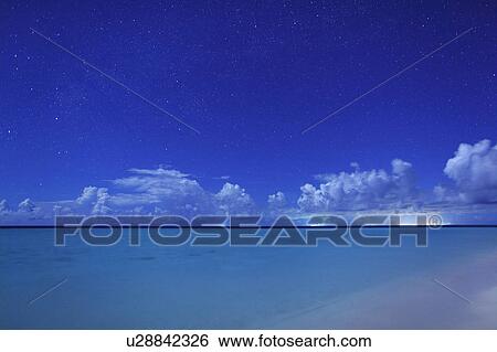 Stock Photograph - Starry Sky Over Sea. Fotosearch