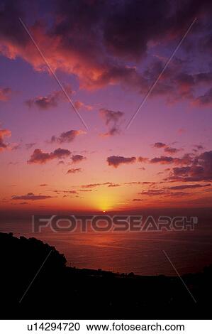Stock Image - Sunrise and ocean. Fotosearch