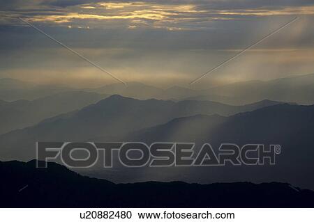 Stock Image - Sunrise glow and Mt. Fuji. Fotosearch