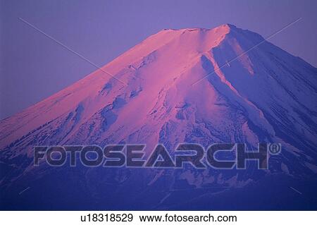 Stock Photo - Sunrise glow and Mt. Fuji. Fotosearch