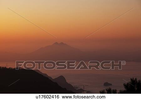 Stock Photograph - Sunset Over Mount Aoba-. Fotosearch