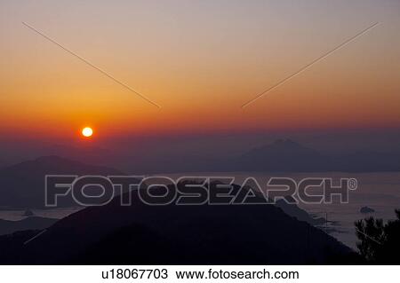 Stock Image - Sunset Over Mountains. Fotosearch