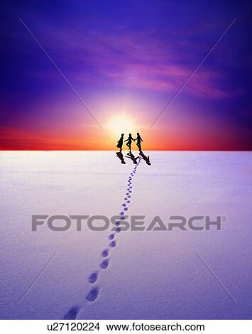 Picture - Three people walking in snow, digital composite. Fotosearch