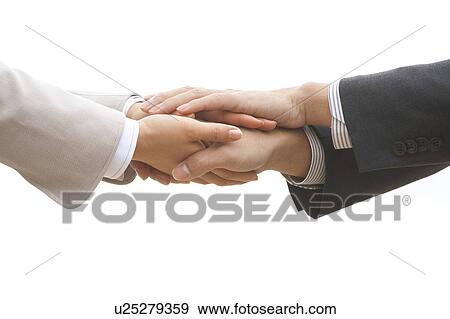 Two Businesspeople Stacking Up Hands View Large Photo Image Stock Photo - Two Businesspeople Stacking Up Hands. Fotosearch